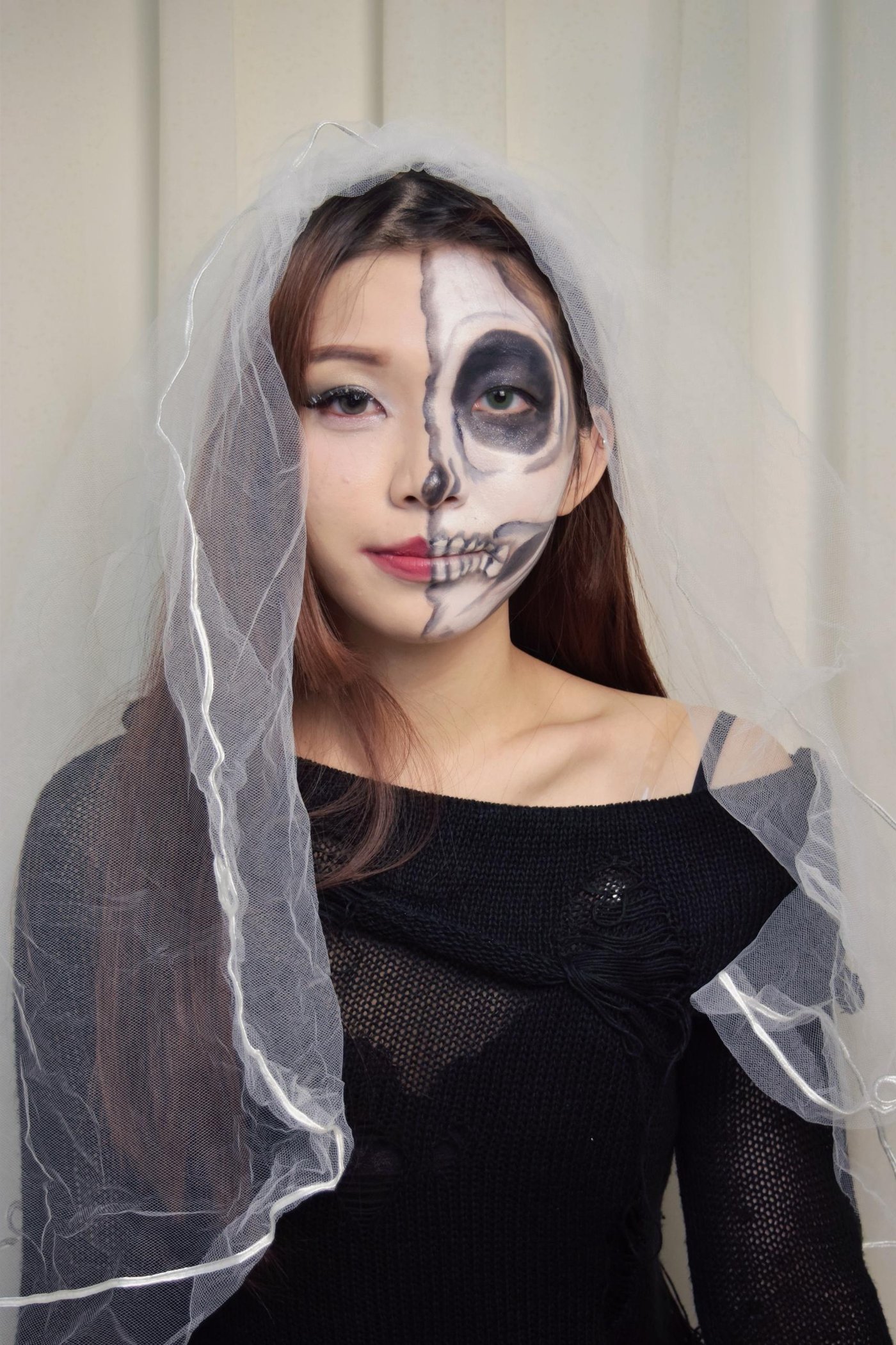 Half skull stage makeup look